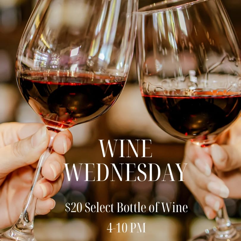 Two hands clinking wine glasses filled with red wine, celebrating "Wine Wednesday" at Frida's Mexican Cuisine.